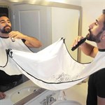 Trimmer / shaving apron with suction cups for mirror